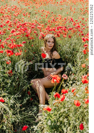 Woman poppies field. portrait happy woman with long hair in a poppy field and enjoying the beauty of nature in a warm summer day. Woman poppies field. portrait happy woman with long hair in a poppy field and enjoying the beauty of nature in a warm summer day. 120225362