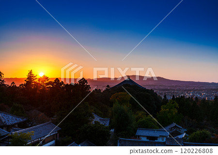 Evening view from the stage of Nigatsudo Hall at Todaiji Temple in Nara - A beautiful gradation of golden and deep blue sky and the setting sun bathing the Todaiji temple grounds① Evening view from the stage of Nigatsudo Hall at Todaiji Temple in Nara - A beautiful gradation of golden and deep blue sky and the setting sun bathing the Todaiji temple grounds① 120226808