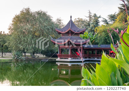 red old building in china with pagodas on the lake shore 120227740