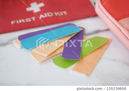 Colorful Bandaids and a wellorganized First Aid Kit on a stunning marble surface 120230608