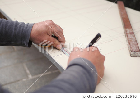 The precise methodology involved in measuring and marking tiles for installation processes 120230686