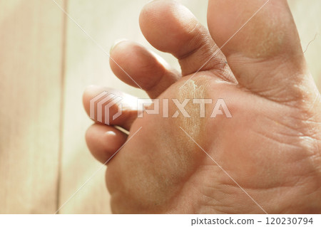 close up of young man dry feet on bed , 120230794
