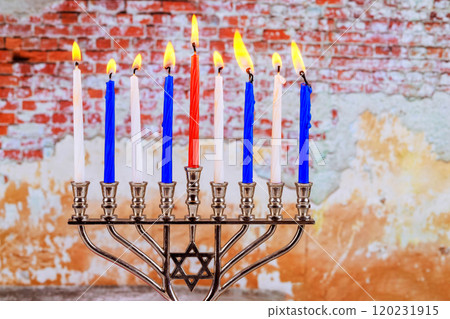Jewish Hanukkah celebration, where nine candles are lit in menorah to create warmth joy in homes Jewish Hanukkah celebration, where nine candles are lit in menorah to create warmth joy in homes 120231915