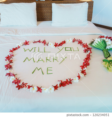 message WILL YOU MARRY ME made of flower petals with bouquet and Heart shape on bed. Idea for marriage proposal, romantic surprise, wedding and engagement concept message WILL YOU MARRY ME made of flower petals with bouquet and Heart shape on bed. Idea for marriage proposal, romantic surprise, wedding and engagement concept 120234051