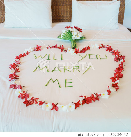 message WILL YOU MARRY ME made of flower petals with bouquet and Heart shape on bed. Idea for marriage proposal, romantic surprise, wedding and engagement concept message WILL YOU MARRY ME made of flower petals with bouquet and Heart shape on bed. Idea for marriage proposal, romantic surprise, wedding and engagement concept 120234052