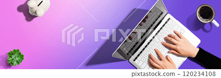 Person using a laptop computer 120234108