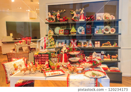 Christmas crockery and flatware on display in a home decoration shop 120234173