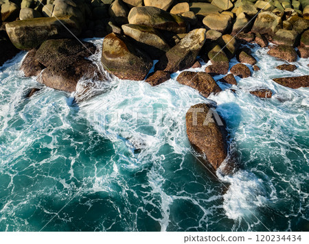 Amazing waves crashing on rocks,Beautiful sea in summer season seascape background ,Nature sea beach waves background Amazing waves crashing on rocks,Beautiful sea in summer season seascape background ,Nature sea beach waves background 120234434