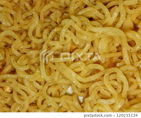 Hot and spicy noodles in the plate. Tasty ramen for breakfast or dinner as a healthy dish Hot and spicy noodles in the plate. Tasty ramen for breakfast or dinner as a healthy dish 120235134