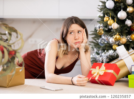 Portrait of a frustrated young woman at home 120235857