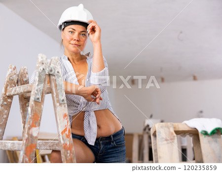 Sexy woman posing in building site 120235859