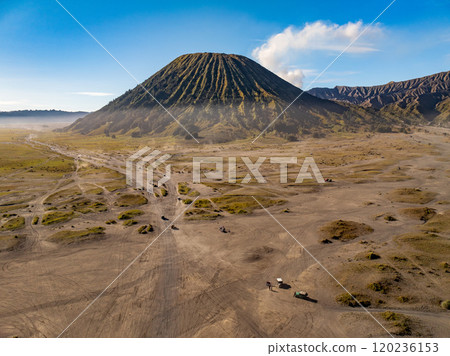 Aerial view of adventure off-road car on path to Mount Bromo volcano, East Java, Surabuya, Indonesia Aerial view of adventure off-road car on path to Mount Bromo volcano, East Java, Surabuya, Indonesia 120236153