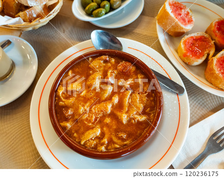 Portion of stewed tripe is cooked in plate - stomach of cattle 120236175