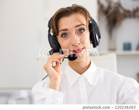 Portrait of positive woman call center worker Portrait of positive woman call center worker 120236263