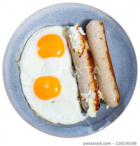 Delicious hearty breakfast with scrambled eggs and sausage closeup Delicious hearty breakfast with scrambled eggs and sausage closeup 120236386