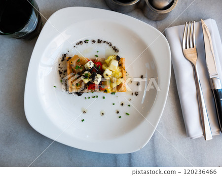 National Spanish coca de escalibada with goat cheese and olives 120236466