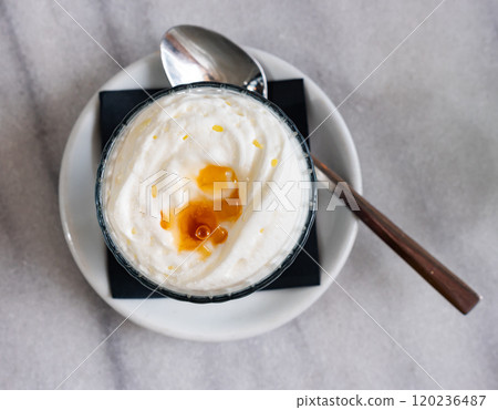 Sweet milk mousse made from yogurt with honey. 120236487
