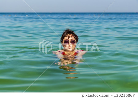 The woman is swimming 120236867