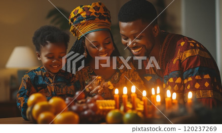 Smiling African American family with a kid celebrating Kwanzaa, wearing vibrant traditional clothing 120237269