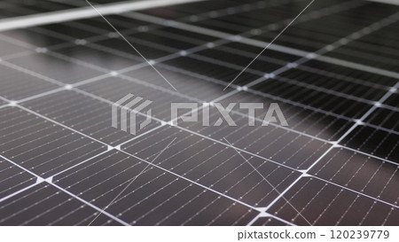 Close-up of modern photovoltaic solar battery panels. Rows of sustainable energy solar panels installed on terrace. Solar panels on roof top. Panels at home. Photovoltaic solar panel extreme close up. 120239779