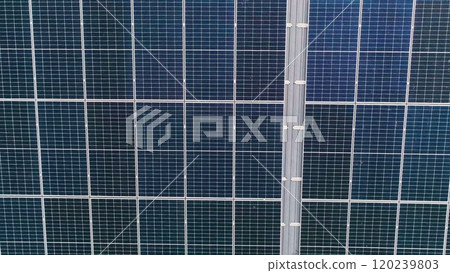 Closeup of surface of blue photovoltaic solar panels mounted on building roof for producing clean ecological electricity. Production of renewable energy concept Closeup of surface of blue photovoltaic solar panels mounted on building roof for producing clean ecological electricity. Production of renewable energy concept 120239803