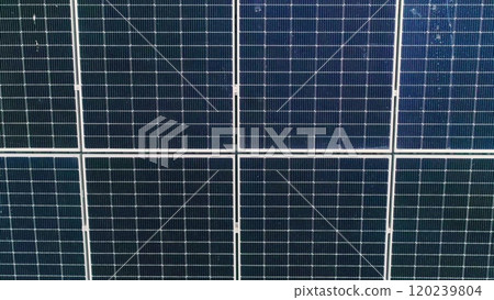 Closeup of surface of blue photovoltaic solar panels mounted on building roof for producing clean ecological electricity. Production of renewable energy concept Closeup of surface of blue photovoltaic solar panels mounted on building roof for producing clean ecological electricity. Production of renewable energy concept 120239804
