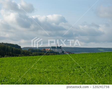 Neresheim, Germany - September 30th 2023: The famous monastery surrounded by hills and forests 120241738