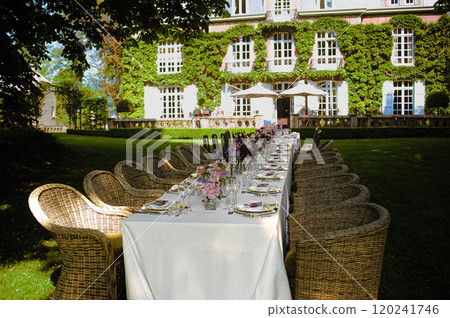 Elegant Garden Dining Setup in a Picturesque Manor Backyard 120241746