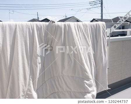 Futon drying on the balcony 120244737