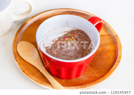 Caffe latte topped with whipped cream 120245957