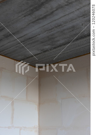 Ceiling from concrete slabs in a new unfinished apartment. 120246078