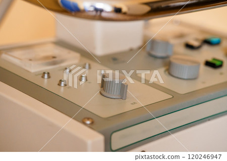Close-Up of Medical Device Control Panel with Dials and Switches 120246947