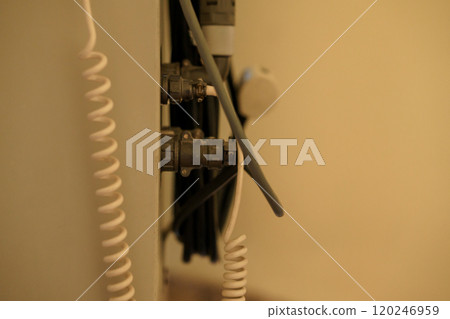 Close-up of Electrical Wiring and Connectors in a Wall-mounted Setup 120246959