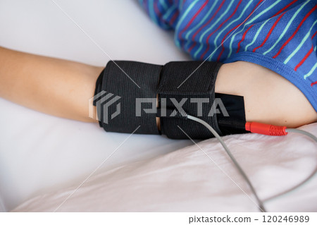 Child Receiving Blood Pressure Measurement with Cuff on Arm 120246989
