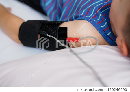 Child Using Health Monitoring Device at Home 120246990