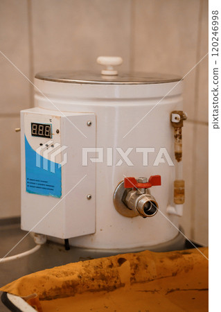 Industrial Water Heater with Digital Display in a Kitchen Environment 120246998