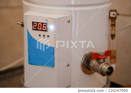 Digital Temperature Control on a White Water Heater with Red Valve Digital Temperature Control on a White Water Heater with Red Valve 120247000