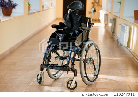 Modern Wheelchair in a Bright Corridor Modern Wheelchair in a Bright Corridor 120247011