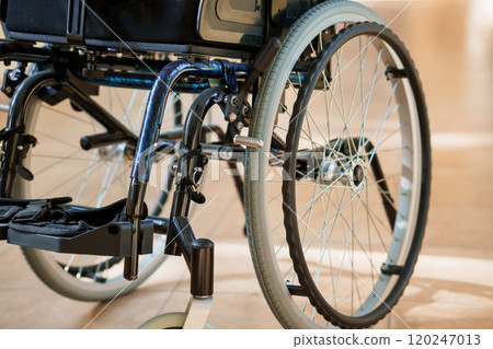 Detailed Close-Up of a Modern Wheelchair Wheel with Focus on Mechanics and Design Detailed Close-Up of a Modern Wheelchair Wheel with Focus on Mechanics and Design 120247013