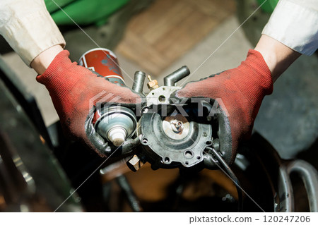 Detailed Inspection and Maintenance of Mechanical Component by Technician in Protective Gloves 120247206