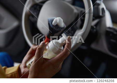 Closeup view on male car master hand using detergent foam and brush Closeup view on male car master hand using detergent foam and brush 120248208