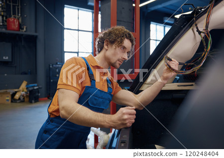 Male auto electric checking car cables and electrical system 120248404