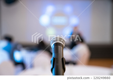 microphone is on microphone stand in seminar meeting room for everyone to use when speaking or greeting seminar participants. microphone is on microphone stand in seminar meeting room for everyone to use when speaking or greeting seminar participants. 120249660