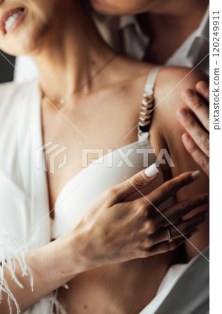 Caucasian young man and woman starting foreplay and making love on bed. 120249911