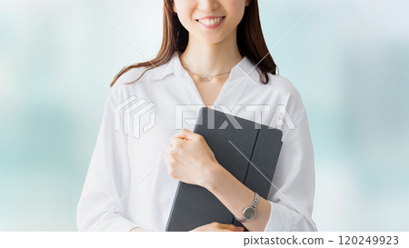 Smiling woman/businesswoman holding a tablet Smiling woman/businesswoman holding a tablet 120249923