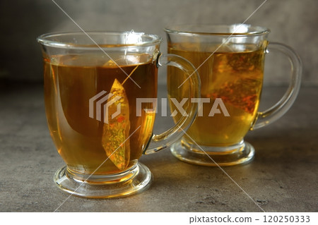 Experience the magical taste of Delightful Herbal Tea beautifully served in lovely glass mugs 120250333