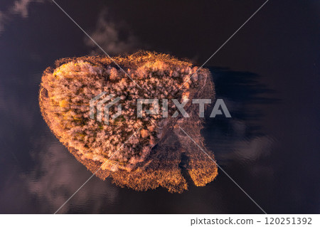 Aerial top view to heart island overgrown with sparse trees in summer sunny day. Skerries Ladoga lake consisting of 650 rocky islands and steep cliffs. National park, Karelia, Russian nature. Aerial top view to heart island overgrown with sparse trees in summer sunny day. Skerries Ladoga lake consisting of 650 rocky islands and steep cliffs. National park, Karelia, Russian nature. 120251392