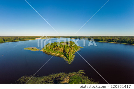 Aerial top view to island in summer evening during white nights. Vuoksa lake river and channels system leaking in Finland and Russia flowing into Ladoga. Romashki village, Leningrad region, karelia. Aerial top view to island in summer evening during white nights. Vuoksa lake river and channels system leaking in Finland and Russia flowing into Ladoga. Romashki village, Leningrad region, karelia. 120251417