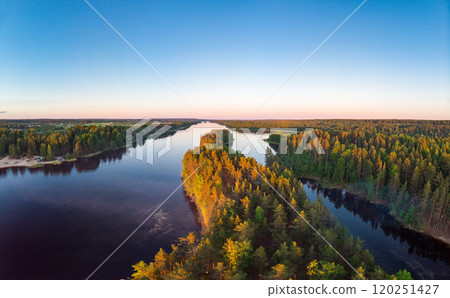 Aerial top view to island in summer evening during white nights. Vuoksa lake river and channels system leaking in Finland and Russia flowing into Ladoga. Romashki village, Leningrad region, karelia. 120251427