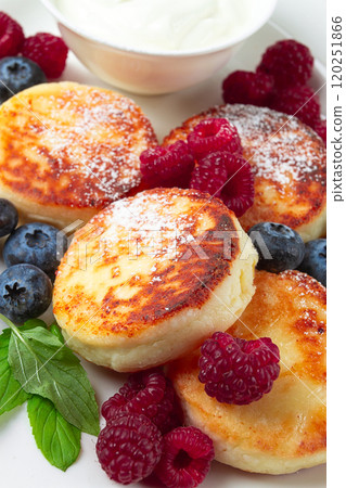 breakfast, cottage cheese cakes, with fresh berries, and sour cream, top view, close-up, no people, breakfast, cottage cheese cakes, with fresh berries, and sour cream, top view, close-up, no people, 120251866